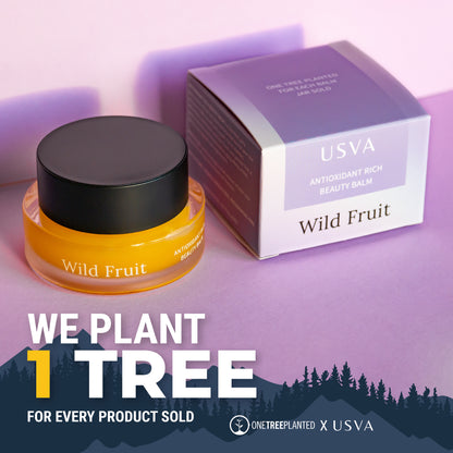 USVA Wild Fruit beauty balm jar and packaging on a purple background with tree planting initiative text.